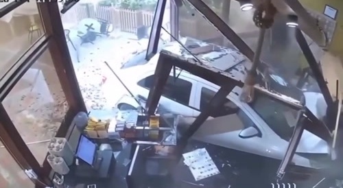 car crashes into a cafe shop