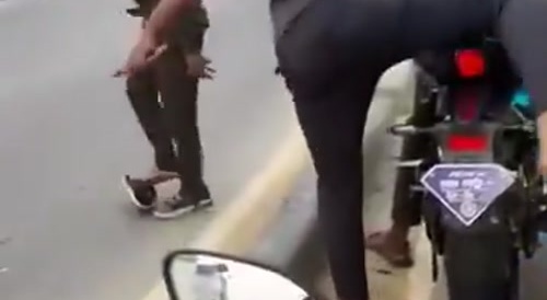 Indians playing tag on highway
