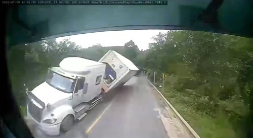 truck takes the turn a bit too fast